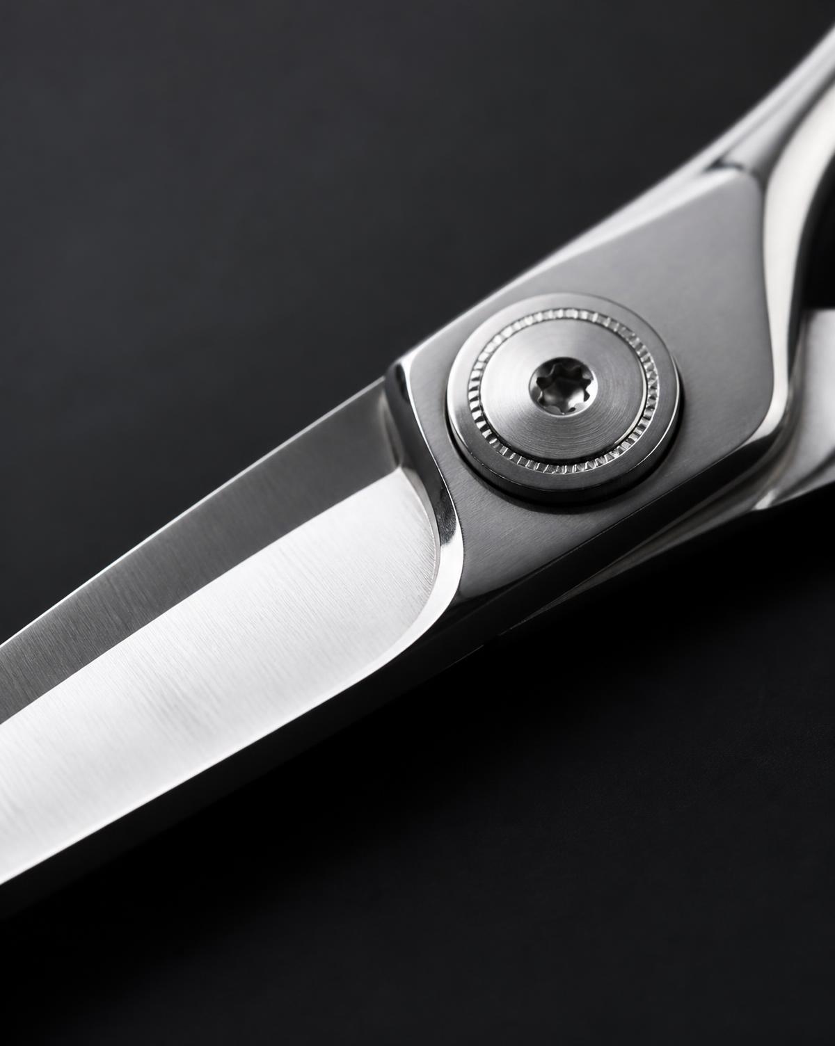 Macro detail of the polished blade and pivot screw